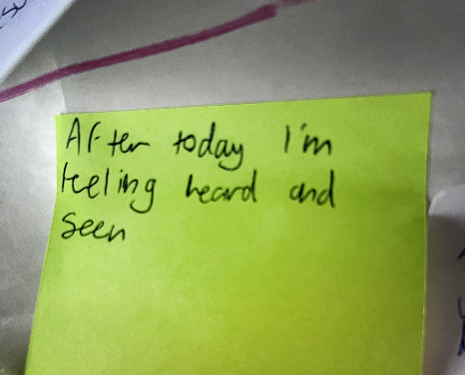 Sticky note from a WCIA event with a child's writing on it saying: "After today I'm feeling heard and seen".